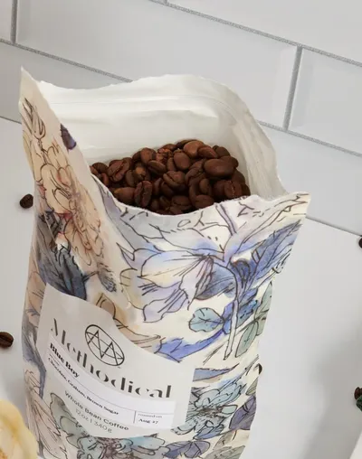 An open bag of freshly roasted whole-bean coffee