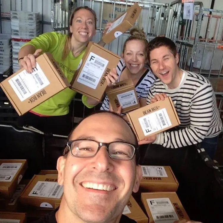 The Bean Box team packing and labeling boxes by hand in the early days